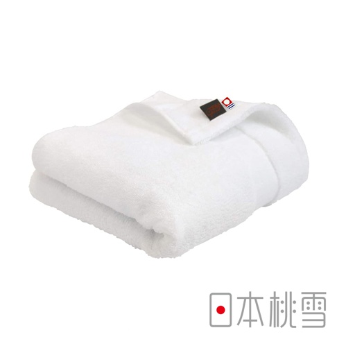白色今治匹馬棉浴巾，質地柔軟，有精緻的品牌標籤。