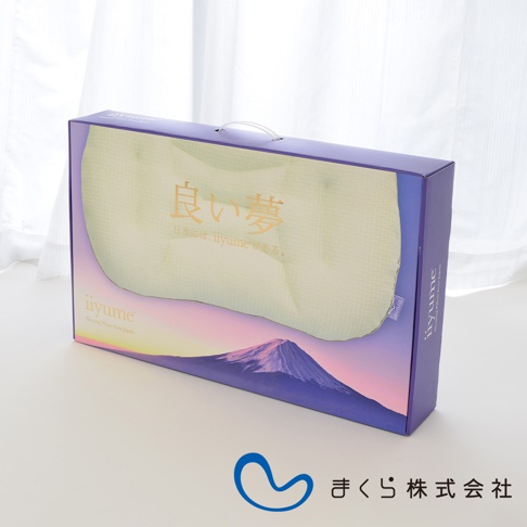 良夢調節枕包裝盒，淡綠色枕頭可見，盒面印有金色日文「良い夢」及富士山日落圖案，以及「iiyume」品牌標誌。