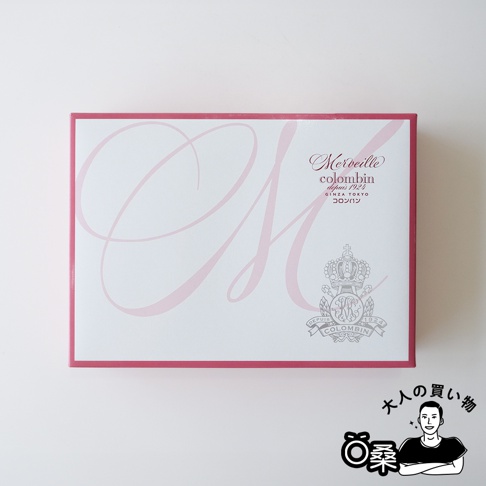 Colombin Merveille 綜合巧克力夾心餅乾禮盒，粉色外盒印有大寫 M 字樣與品牌標誌