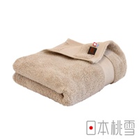 米色今治匹馬棉浴巾，質地柔軟，邊緣有品牌標籤。