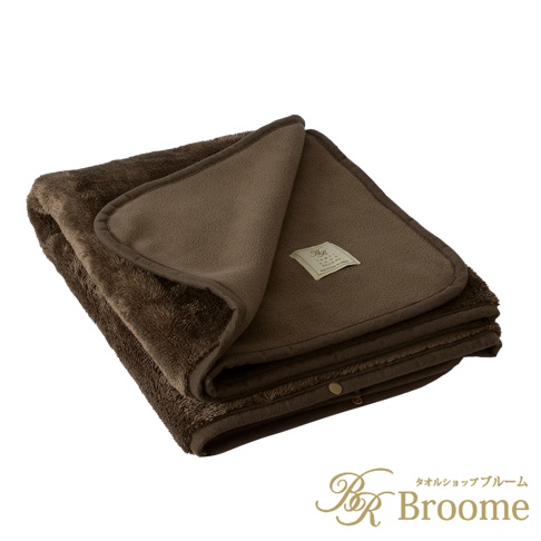 深棕色鋪棉保暖毯，一面為絨毛材質，另一面為平滑絨布。毯子折疊展示，邊緣有滾邊設計，一角有品牌標籤。
