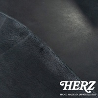 HERZ 品牌標誌，下方為 HAND MADE IN JAPAN Since1973，圖片為黑色皮革特寫