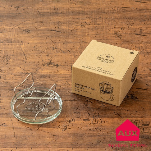 玻璃底座搭配銀色金屬可調式耳掛，用於懸掛咖啡濾掛包。產品包裝為牛皮紙盒，上面印有品牌標誌和產品說明。