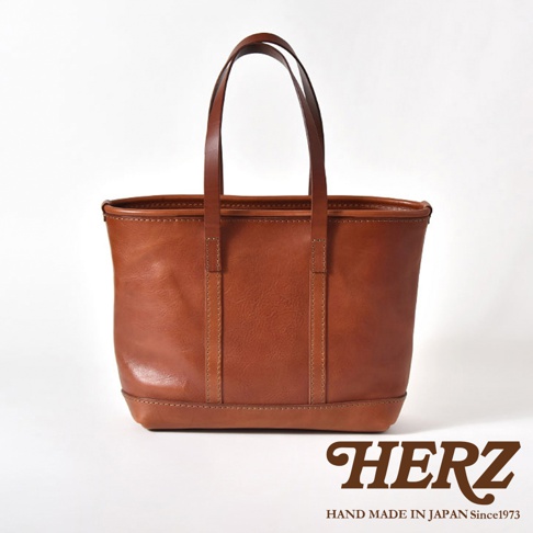 職人手作皮革經典托特包，棕色牛皮材質，簡約設計，雙提把，適合日常攜帶。