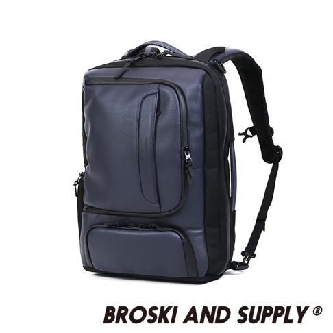 防水真皮革兩用手提後背包，深藍色，主體為荔枝紋真皮革，搭配黑色尼龍布料，設有拉鍊主隔層、前方拉鍊口袋及下方翻蓋式口袋，两侧有提把及可拆卸肩帶。