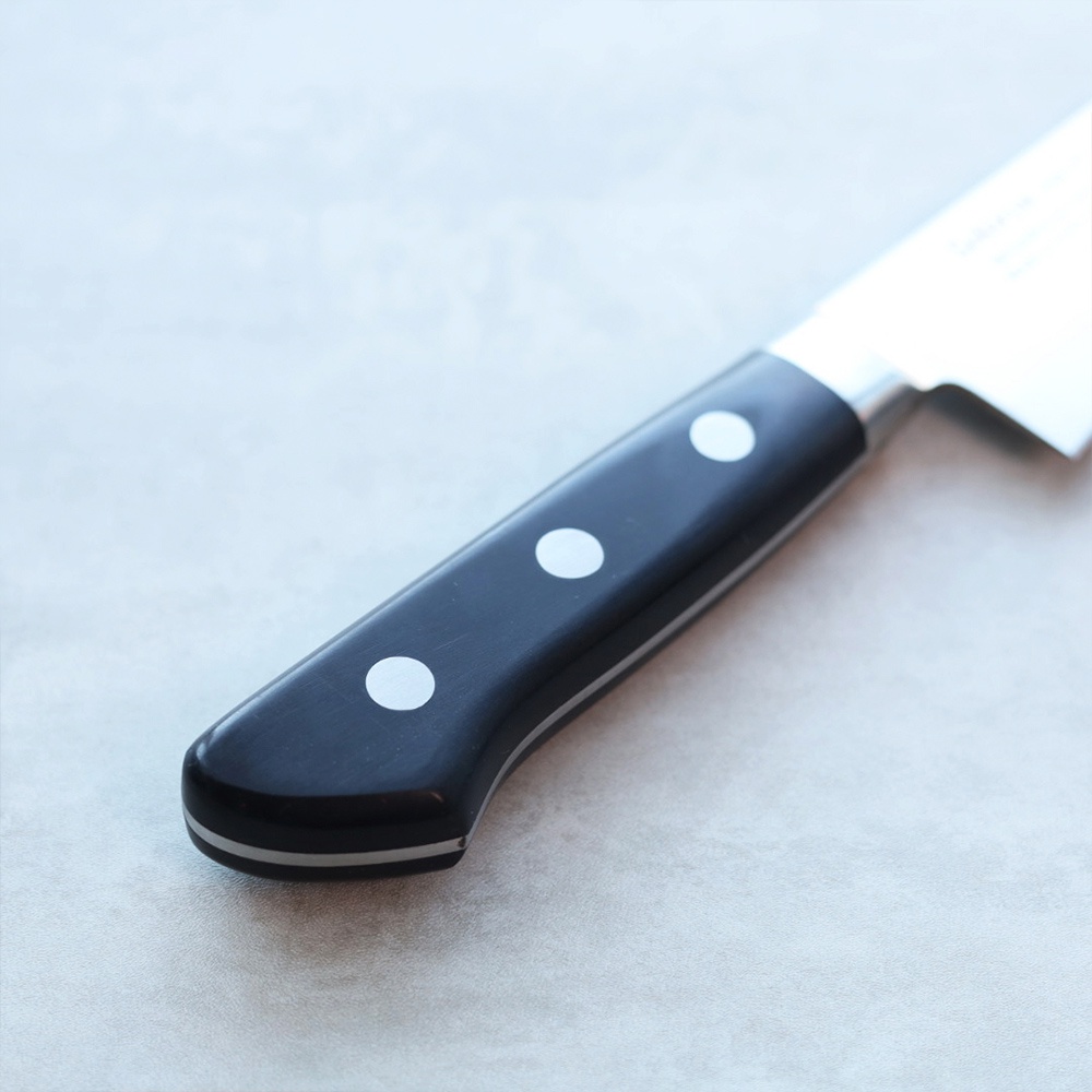 鉬釩不鏽鋼三德刀，黑色握柄，帶有三個銀色圓點裝飾，刀柄與刀刃之間有金屬接合處。