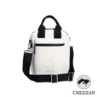 白色方形高爾夫側背包，帶有黑色提把、可拆卸肩帶和拉鍊前袋。包身飾有圓形壓印 Logo 及品牌名稱。