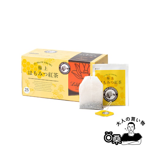 一盒標有「極上蜂蜜紅茶」字樣的黃色茶葉包裝盒，盒旁有兩包獨立包裝的茶葉，其中一包已打開。