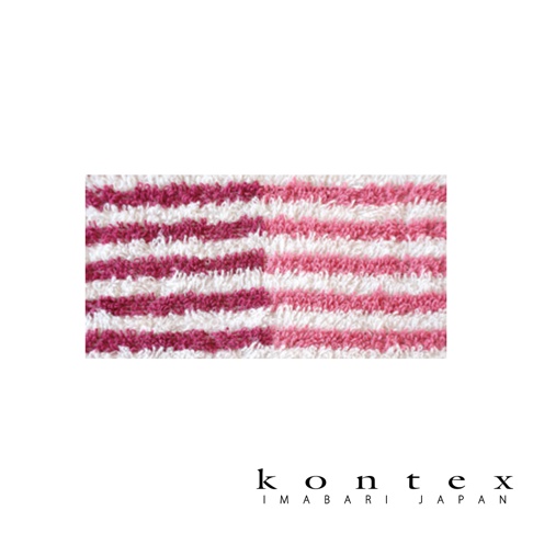 這是一條 Kontex 今治有機棉麻迷你浴巾的近拍特寫，顯示毛巾質地細緻的白色條紋與左右兩側深淺不同的粉紅色條紋對比，下方印有 Kontex Imabari Japan 的品牌標誌。