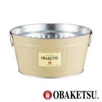 OBAKETSU 標誌的奶油色迷你桶，頂部和底部有金屬飾邊，側邊有兩個提把，正面有標籤，上面寫著「Long Life Design OBAKETSU since 1923 MADE IN JAPAN」。