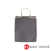 深灰色棉織購物袋，配有米白色編織提把，袋口有金色滾邊裝飾。