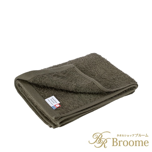 Jupe 今治40支輕薄純棉居家毛巾，呈現深綠色，質地柔軟，邊緣有品牌標籤，展示居家生活品味。