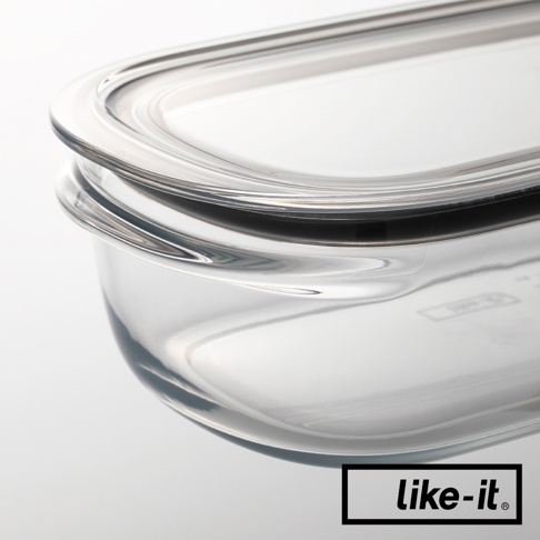 透明玻璃保鮮盒，帶有密封矽膠圈的透明蓋子，盒身邊緣有弧形提把。