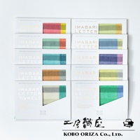 TETE 今治格紋信封式長方形手帕，展示了多種柔和色調的格紋設計，包括粉紅色、綠色、藍色、橘色和紫色等。手帕採用精細織法，材質應為棉，呈現細膩的紋理。