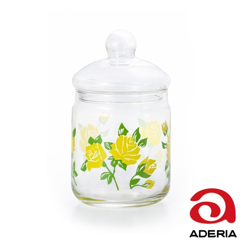 昭和復古玻璃儲物罐，透明玻璃材質，罐身印有黃色玫瑰與綠色葉子圖案，附有圓球狀玻璃蓋。