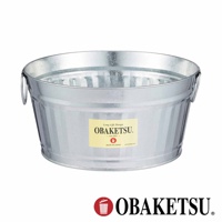OBAKETSU 標誌的銀色金屬圓形提桶，桶身側面貼有黃色標籤，標籤上印有 OBAKETSU 品牌名稱，下方標示「since 1923」和「MADE IN JAPAN」。