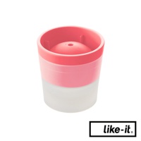 粉紅色和半透明白色塑膠製成的威士忌冰球製冰盒，頂部有圓形冰球模具，底部為半透明杯狀。