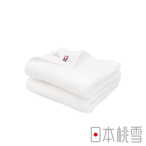 疊放的兩條白色毛巾，材質柔軟，其中一條毛巾上露出品牌標籤，印有「hiarie」字樣及藍紅條紋圖案。