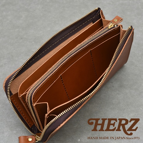 職人手作皮革Organ大容量拉鍊長夾，展現內部多層隔層與卡槽設計，整體為棕色調，搭配精緻的金色拉鍊，展現質感。