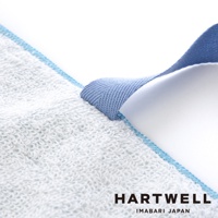 今治毛巾材質的牙刷收納袋，織有藍色織帶，邊緣飾有藍色縫線，特寫鏡頭展示毛巾的柔軟質感。