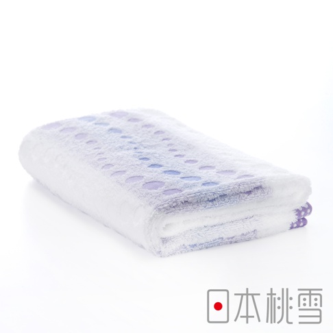 今治水泡泡浴巾，白色毛巾上印有紫色漸層的圓點圖案，觸感蓬鬆柔軟。