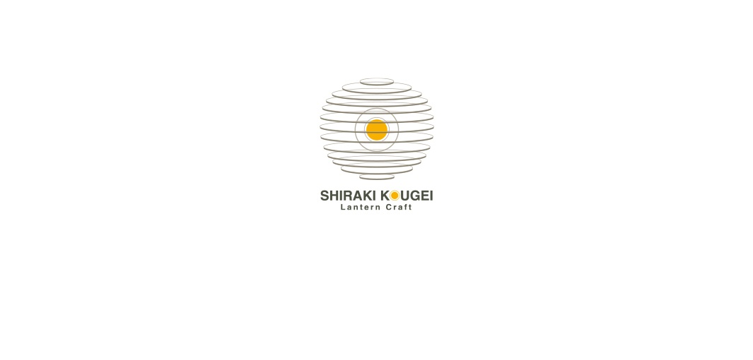 Shira-Kougei 達摩不倒翁迷你提燈，圓球造型，以多層次線條構成，中間嵌有黃色圓點，搭配「SHIRAKI KOUGEI Lantern Craft」文字標誌。