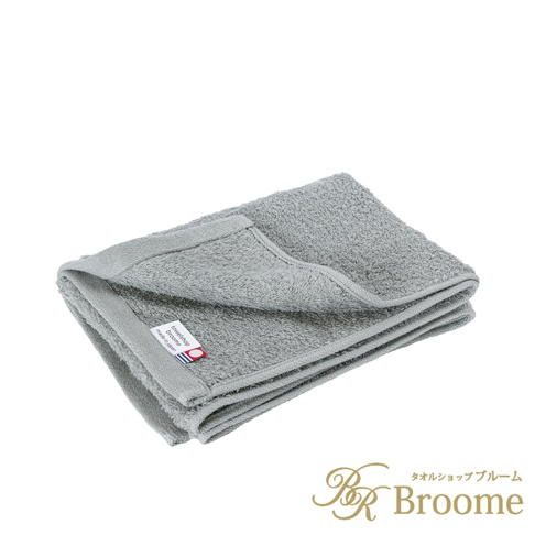 Jupe 今治40支輕薄純棉居家毛巾，灰色，觸感柔軟，材質輕盈。毛巾折疊整齊，標籤上印有「towels hop broome made in japan」字樣。