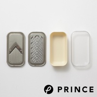 磨泥切片兩用盒，包含金屬切片器、金屬磨泥板、米白色收納盒及透明盒蓋，皆為長方形設計。