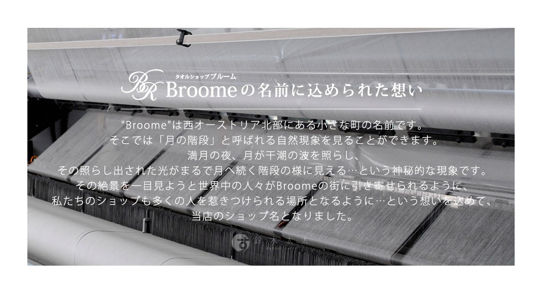 織布機正在生產細緻的灰色織物，織線交錯排列，營造出紋理感。