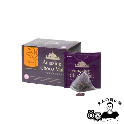 Lakshimi 驚奇可可風味紅茶，盒裝內含 15 包茶包，其中一包已取出展示，包裝設計以紫色為主，印有金色圖案與日文、英文商品名稱