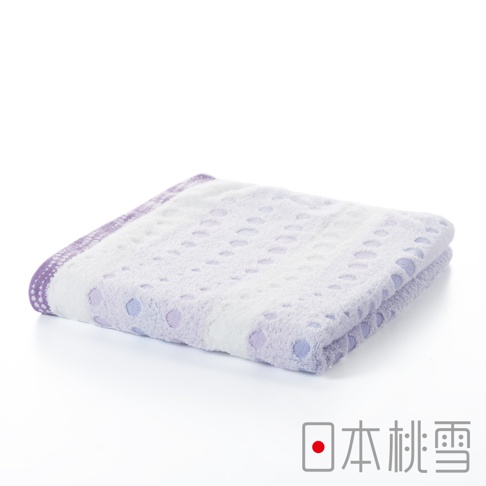 一條折疊的今治水泡泡毛巾，主體為白色，帶有淺紫色圓點圖案及紫色滾邊，材質柔軟，質地輕盈。