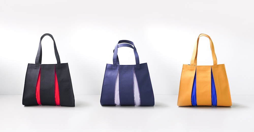 三款京都職人手作ougi棉帆布扇形托特包，分別為黑色搭配紅色內襯、深藍色搭配淺紫色內襯、以及金黃色搭配亮藍色內襯。