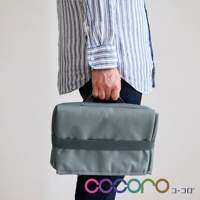 灰色折疊購物車，材質為帆布，配有深灰色織帶，方便攜帶。