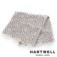 今治柔彈伸縮美肌枕套，米白色織物印有灰色菱形格紋，材質柔軟，邊緣有白色滾邊。