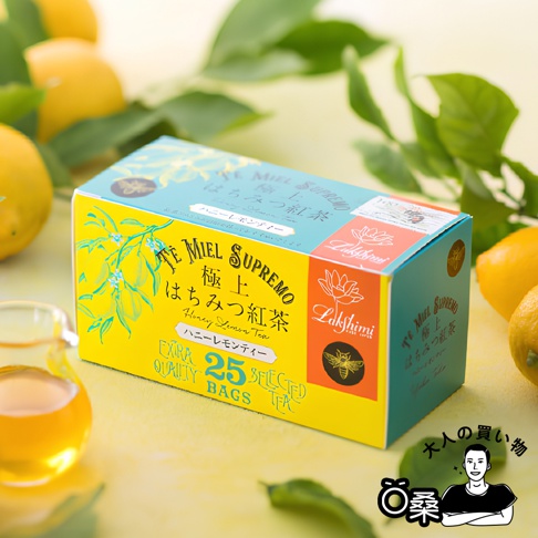 Lakshmi 蜂蜜風味檸檬紅茶，包裝上有極上、Honey Lemon Tea、ハニーレモンティー、EXTRA QUALITY、25 BAGS、SELECTED TEA 等字樣，周圍有檸檬和茶杯。