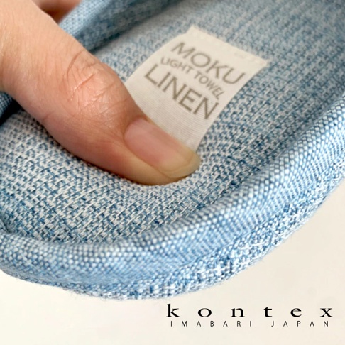 MOKU 棉麻室內拖鞋，淺藍色，織紋材質，帶有「MOKU LIGHT TOWEL LINEN」標籤。