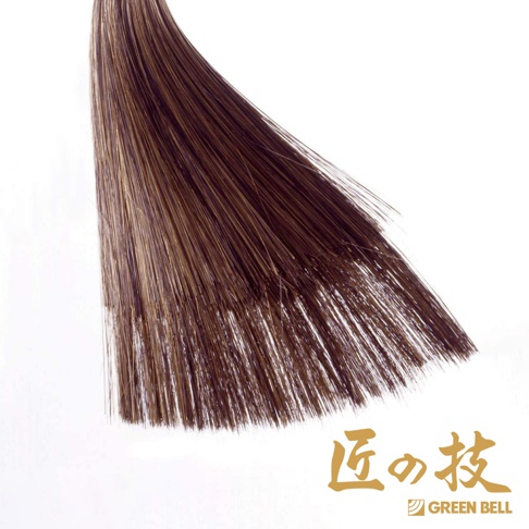 一束淺棕色至深棕色的頭髮，髮尾整齊，背景為白色，右下角有金色日文「匠の技」字樣和綠色「GREEN BELL」標誌。