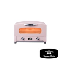 粉色復古多用途烤箱，配有銀色提把和玻璃門，內部可見加熱管和烤網。烤箱前方有兩個黑色旋鈕和一個印有「Sengoku Aladdin」標誌的黑色銘牌。