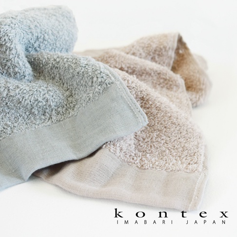 兩條 PRIMAVERA 超細纖純棉浴巾，一條為淺藍色，另一條為米色，皆呈現蓬柔的素面質感。