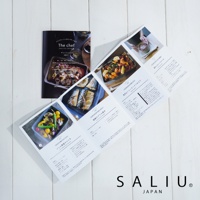 The chef 產品目錄，展示以耐熱陶製烤盤烹調的烤魚、蔬菜料理、海鮮燉飯及巧克力蛋糕。