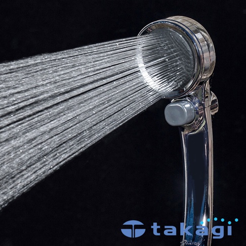 銀色金屬材質蓮蓬頭，正在噴射細緻水流，側面有灰色調節按鈕。