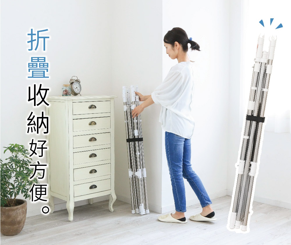 雙桿不鏽鋼曬衣架，銀白色，高度約 1.5 公尺，可折疊收納。