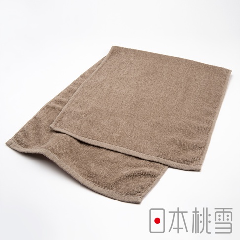 一條棕色運動綁頭毛巾，由柔軟毛圈織物製成，邊緣有縫線。