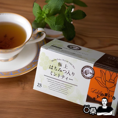 Mentha Polco Miel SUPREMO 極上はちみつ入りミントティー，盒裝上有 25 包茶包，搭配精緻的茶杯和新鮮薄荷葉。