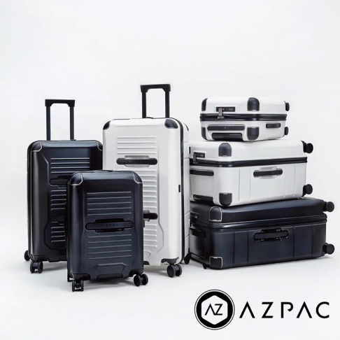 AZPAC Trucker 系列旅行箱，展示黑色與白色共兩款，包含不同尺寸，皆為硬殼材質，配備防爆拉鍊、伸縮拉桿及萬向輪。