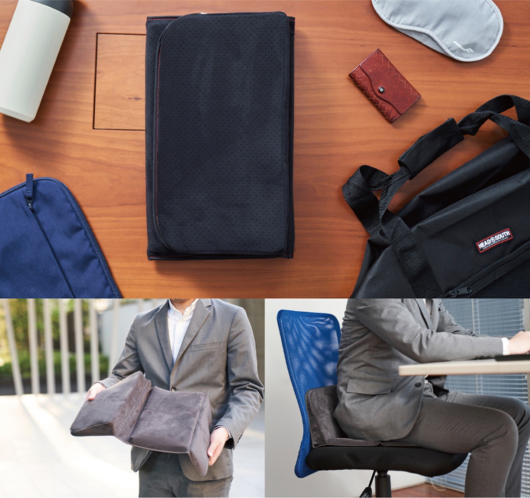 深灰色折疊式腰靠坐墊，表面帶有細小圓孔，紅色縫線。坐墊可展開成兩部分，用於支撐腰部。