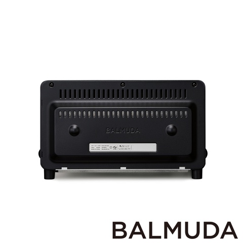 黑色BALMUDA蒸氣烤麵包機專業版K11C-SE的背面，帶有通風孔、品牌標誌和產品資訊標籤。