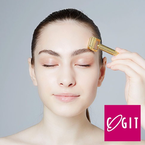 COGIT 美顏提拉滾輪，用於額頭按摩，下方有品牌 Logo。