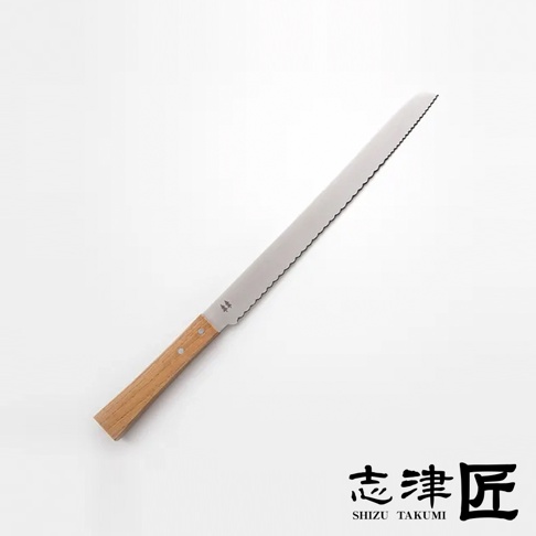 Morinoki 麵包刀，銀色鋸齒狀不鏽鋼刀刃，搭配淺棕色木質握柄，刀刃靠近握柄處有兩個小鉚釘及一組四個小樹圖案的品牌標誌。