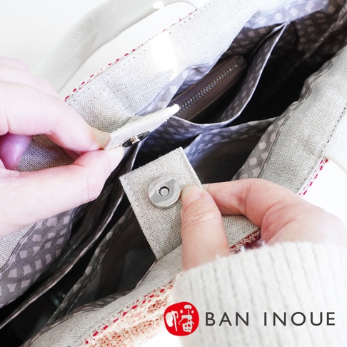 BAN INOUE 品牌帆布手提袋特寫，展示磁釦開合和內袋細節